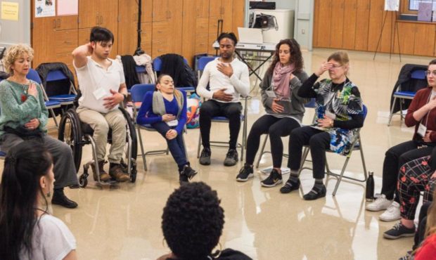 Photo Caption: Heidi Latsky and company lead APLI cohort members in a seated warm-up at the United We Discover event, February 2020.