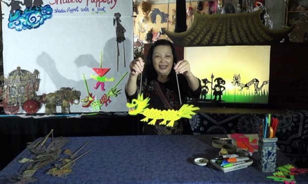 Hua Hua Zhang demonstrating shadow puppetry